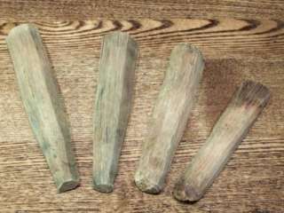 These wood spikes were hand carved and weathered over time. They are 