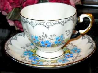 TUSCAN BLUE BLOSSOM PAINTED BEADED TEA CUP AND SAUCER  