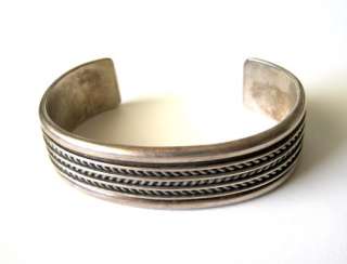 Solid sterling silver cuff bracelet by Navajo artisan Tom Hawk. It 