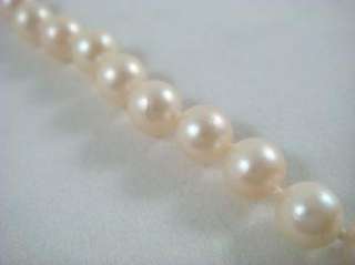 Very nice single strand pearl and gold necklace. The hook is stamped 