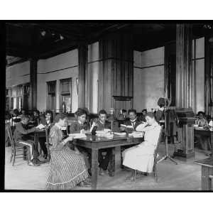   and female students sitting at tables, reading, at the: Home & Kitchen