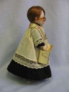 drape little minister has a madame alexander metal and lucite stand 