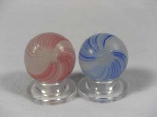 This is a great pair of old handmade German Banded Opaque Marbles with 
