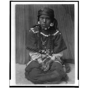  Kalispel Indian girl sitting on her knees,c1910,Edward S 