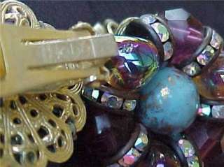   rhinestones & large blue stone in the centerVery good condition
