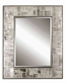 Antiqued, tiled mirrors surround the center beveled mirror and 